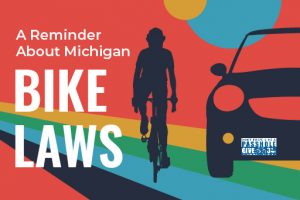 A Reminder About Michigan Bike Laws with Cyclist Passing Car