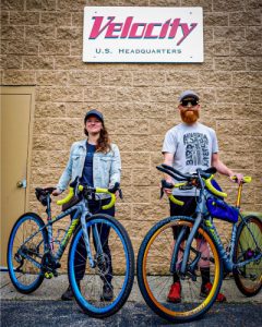 Jill and Matt posing by Velocity sign