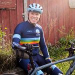 bryan waldman with bicycle by barn