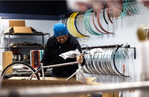 Detroit Bikes employee assembling bike