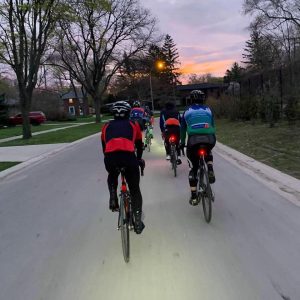 Morning Cranks club riding together at sunrise